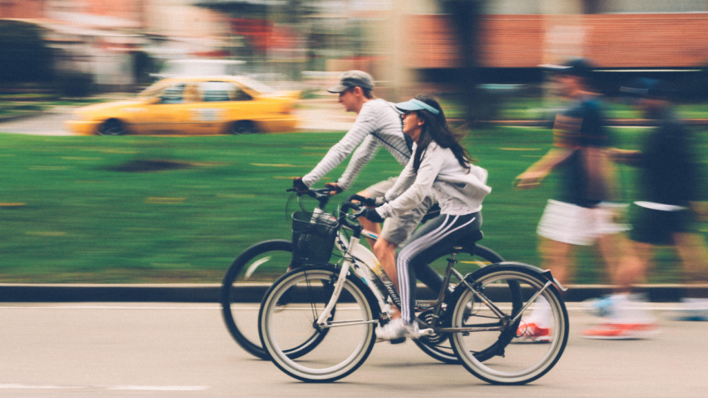 Man and Woman riding on a Bike 