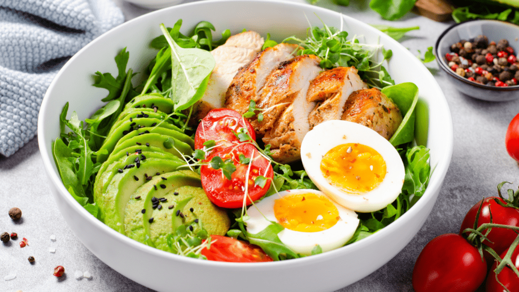 Chicken, eggs avocado and vegetables