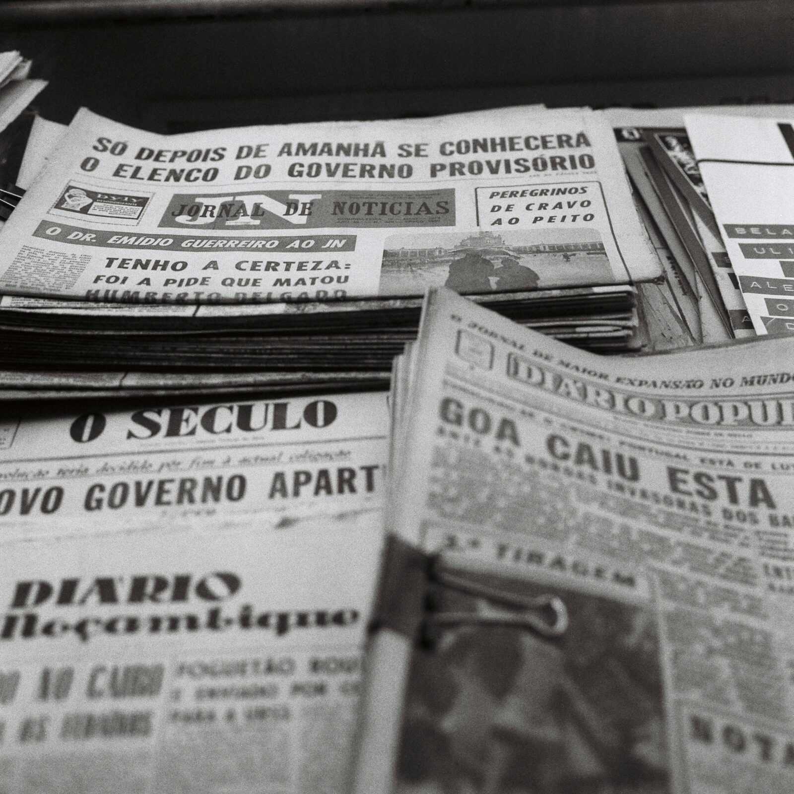 Piles of Different Newspapers